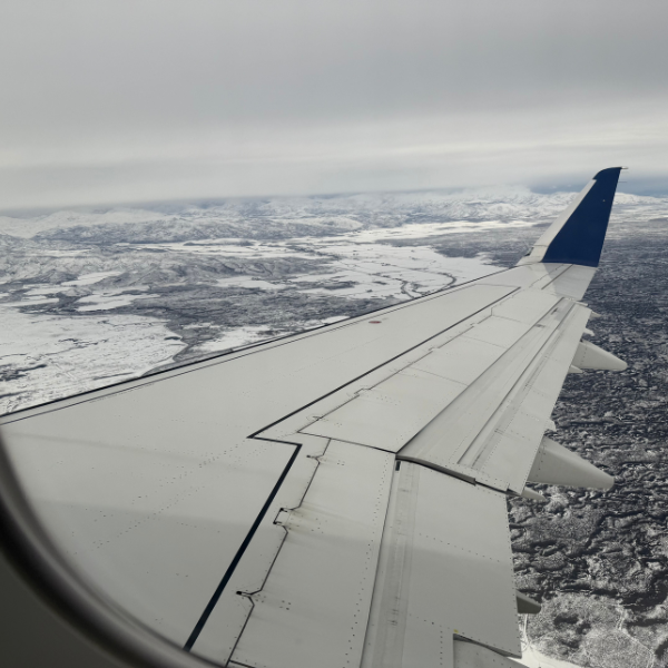 Airplane flying over snow