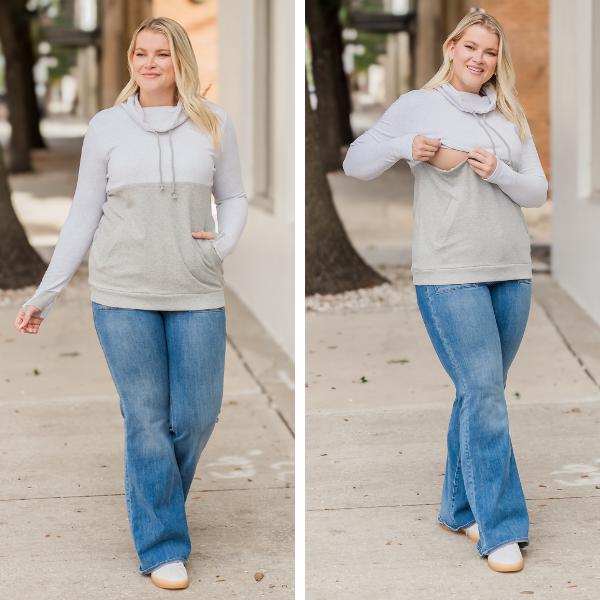 Mom wearing nursing sweatshirt with hidden breastfeeding access