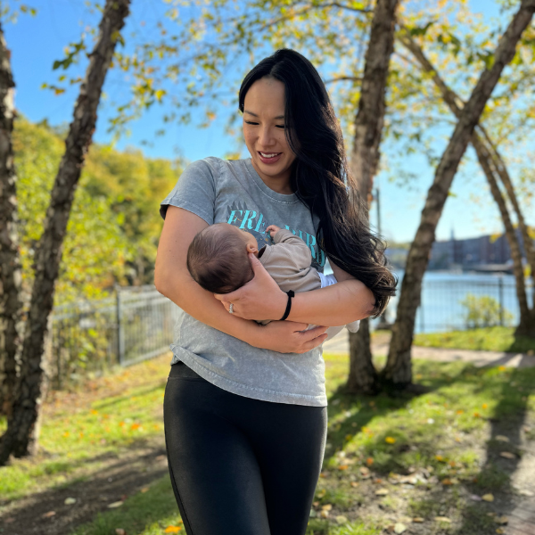 Mom nursing baby in breastfeeding tee