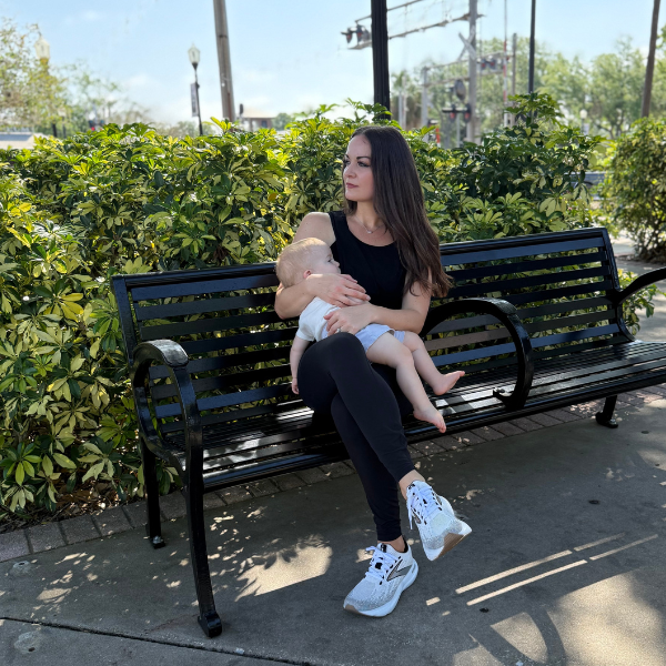 Mom breastfeeding child in nursing tank