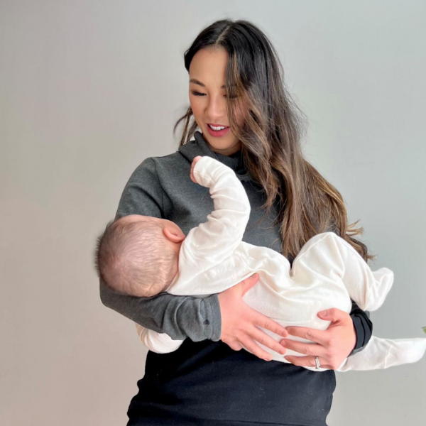 Mom nursing her baby in a breastfeeding hoodie