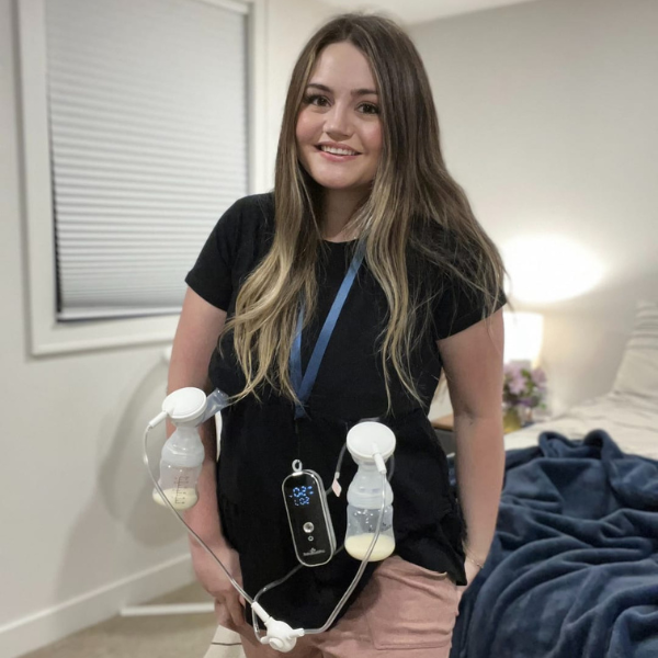 Mom pumping in a breastfeeding shirt