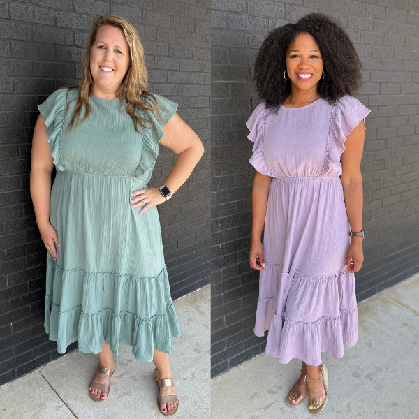 Side-by-side photo of two moms wearing the same Nursing Queen nursing dress in sizes medium and 2X, showing size inclusive fit for breastfeeding and postpartum bodies.