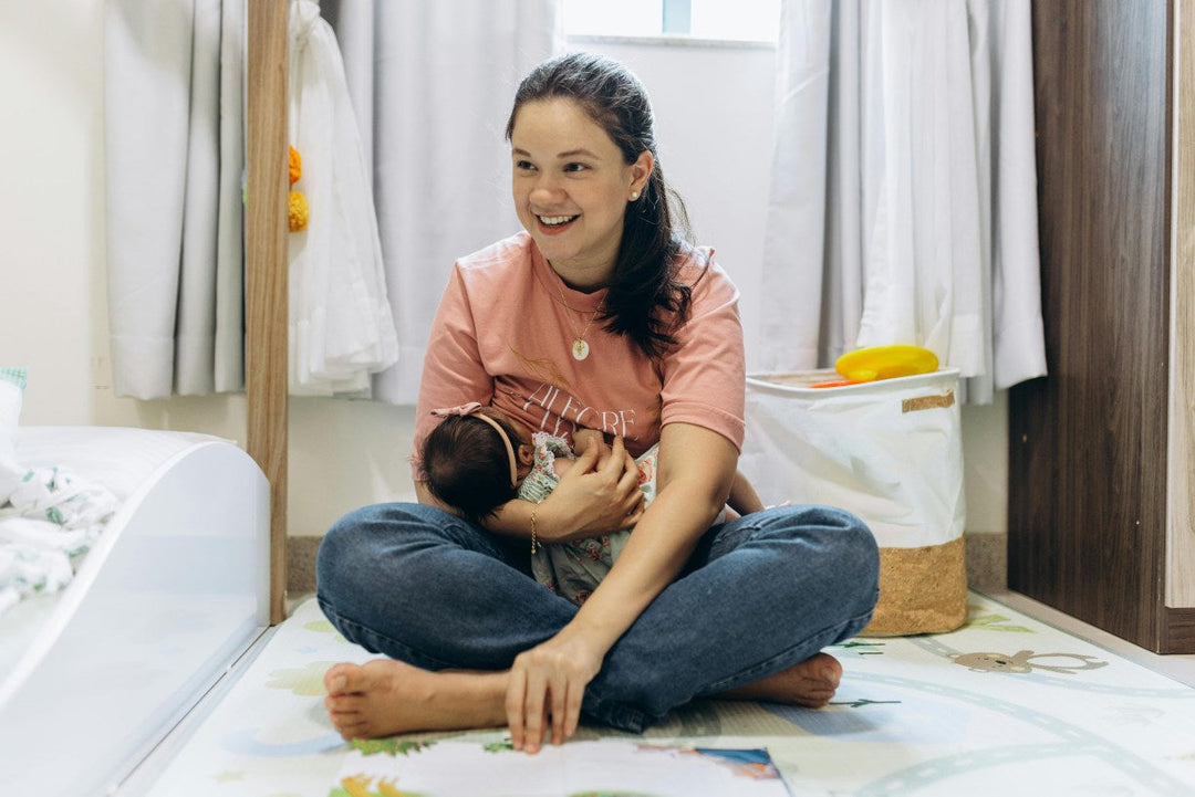 mom in pink t-shirt with baby