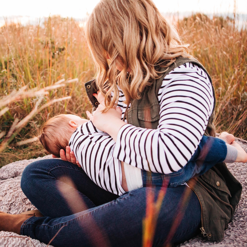 mom breastfeeding wearing nursing shirt with hidden zipper access