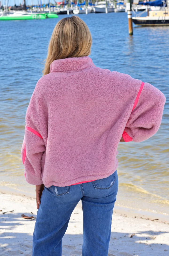 Back view of a mom wearing a pink fleece
