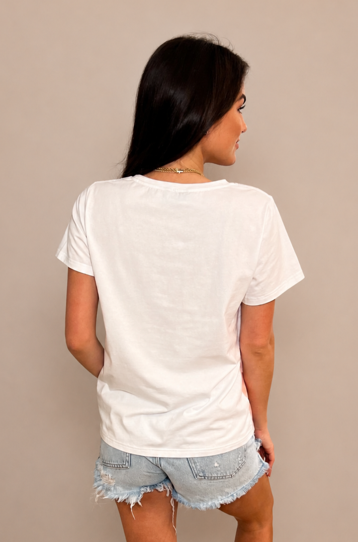 A back view shows a mom wearing the Chevron hot peach breastfeeding t-shirt paired with shorts with a relaxed silhouette and full coverage.