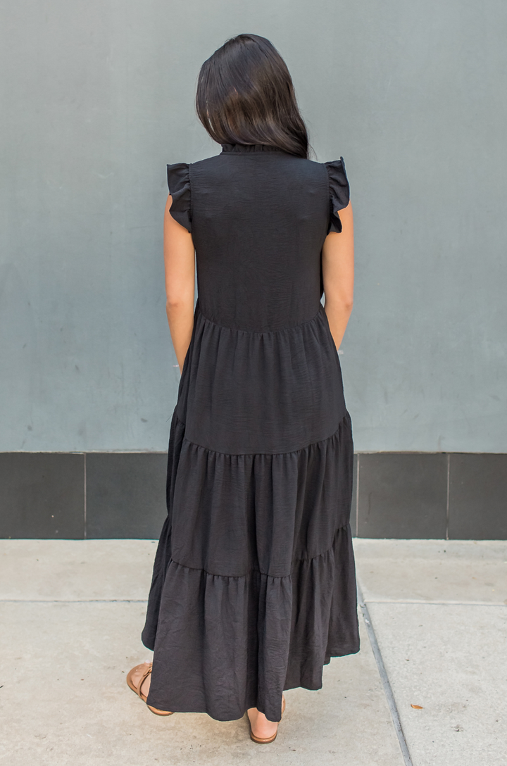 Mom wearing a black nursing dress showing the back of the dress