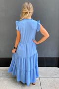Back view of midi dress with ruffle sleeves, hidden nursing access, and flowy postpartum-friendly silhouette with pockets