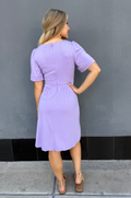 Lilac maternity and nursing dress with concealed zipper access for breastfeeding, soft fabric, pockets, and comfortable fit for moms on the go