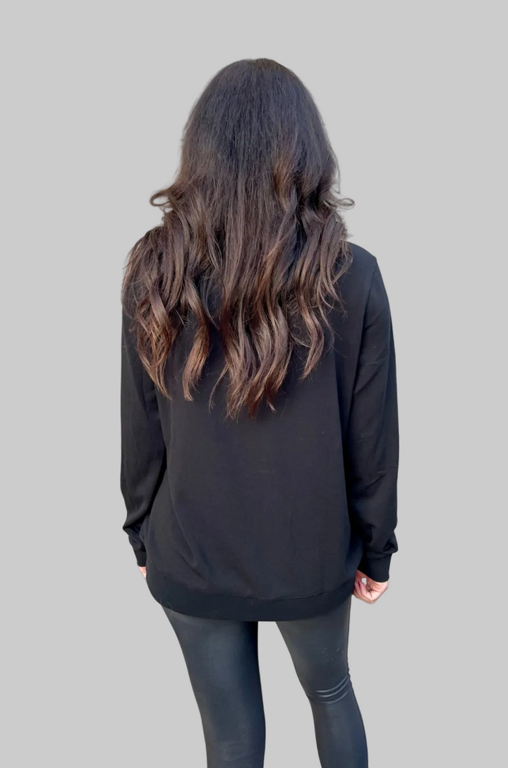 The back view of the black crewneck breastfeeding sweatshirt shows its classic crewneck design and comfortable shape.