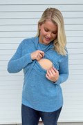 Mom wearing sweater with lift up access for pumping and nursing