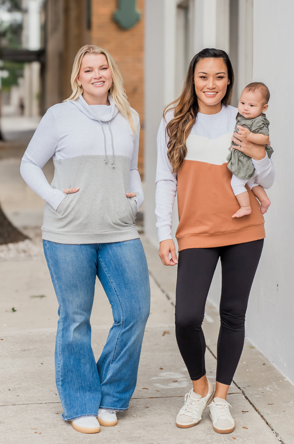Moms wearing nursing queen sweatshirts for easy breastfeeding access