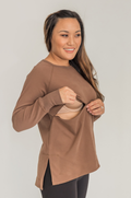 Mom wearing brown nursing tunic with hidden zipper access
