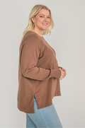 Mom wearing brown breastfeeding tunic with hidden zipper access for pumping and nursing