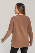 Mom wearing brown yoga breastfeeding tunic