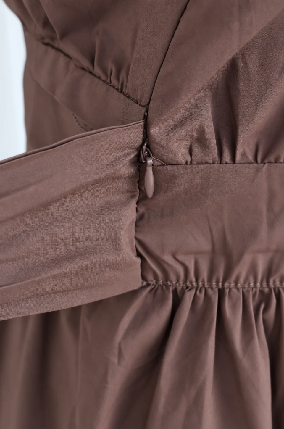 Close up of nursing access hidden under a faux belt 
