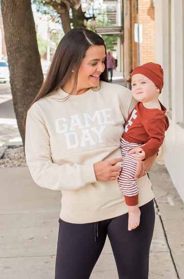 Mom and baby in Game Day nursing sweatshirt