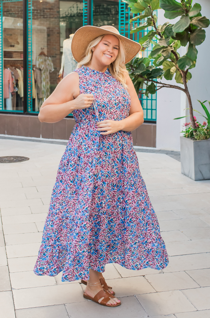 A close-up shows a mom opening the hidden zipper breastfeeding access on the berry garden tie-back bow dress for discreet feeding.