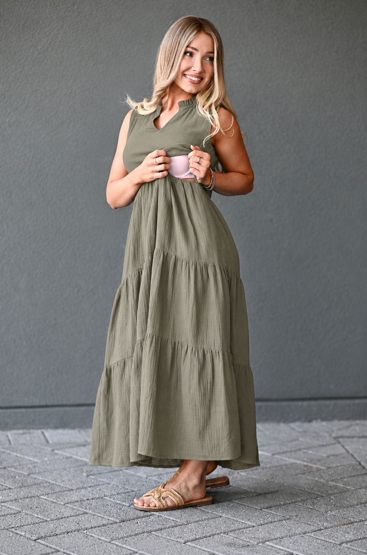 Woman showing how nursing access works in a cotton gauze breastfeeding dress