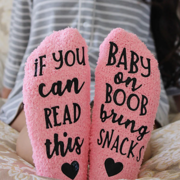 Gift basket for breastfeeding mom includes novelty socks for nursing and pumping moms.