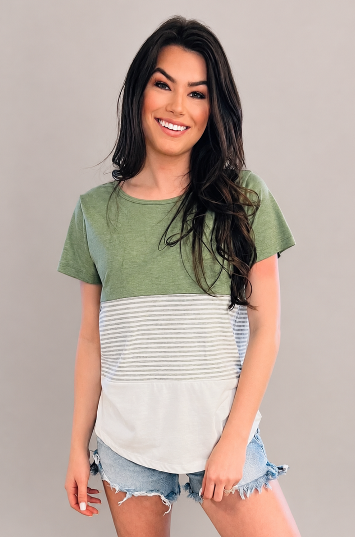 A mom wears the Nursing Queen green 3-block colorblock breastfeeding t-shirt with a relaxed, everyday fit perfect for casual wear.