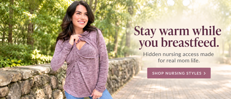 A mom showing her hidden nursing access in a sweater for fall and winter to breastfeed on the go