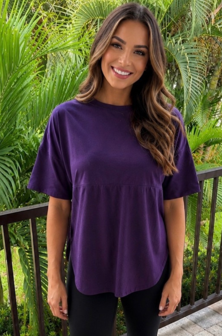 Mom wearing a purple high hip breastfeeding tunic with hidden access for nursing