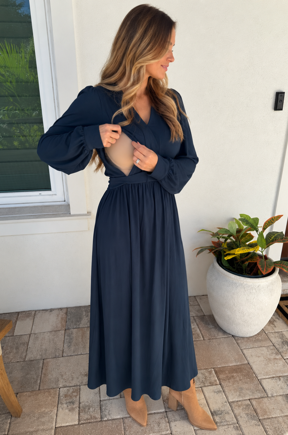 Mom showing her nursing access hidden in a breastfeeding dress