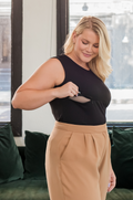 Black nursing top with tan pants
