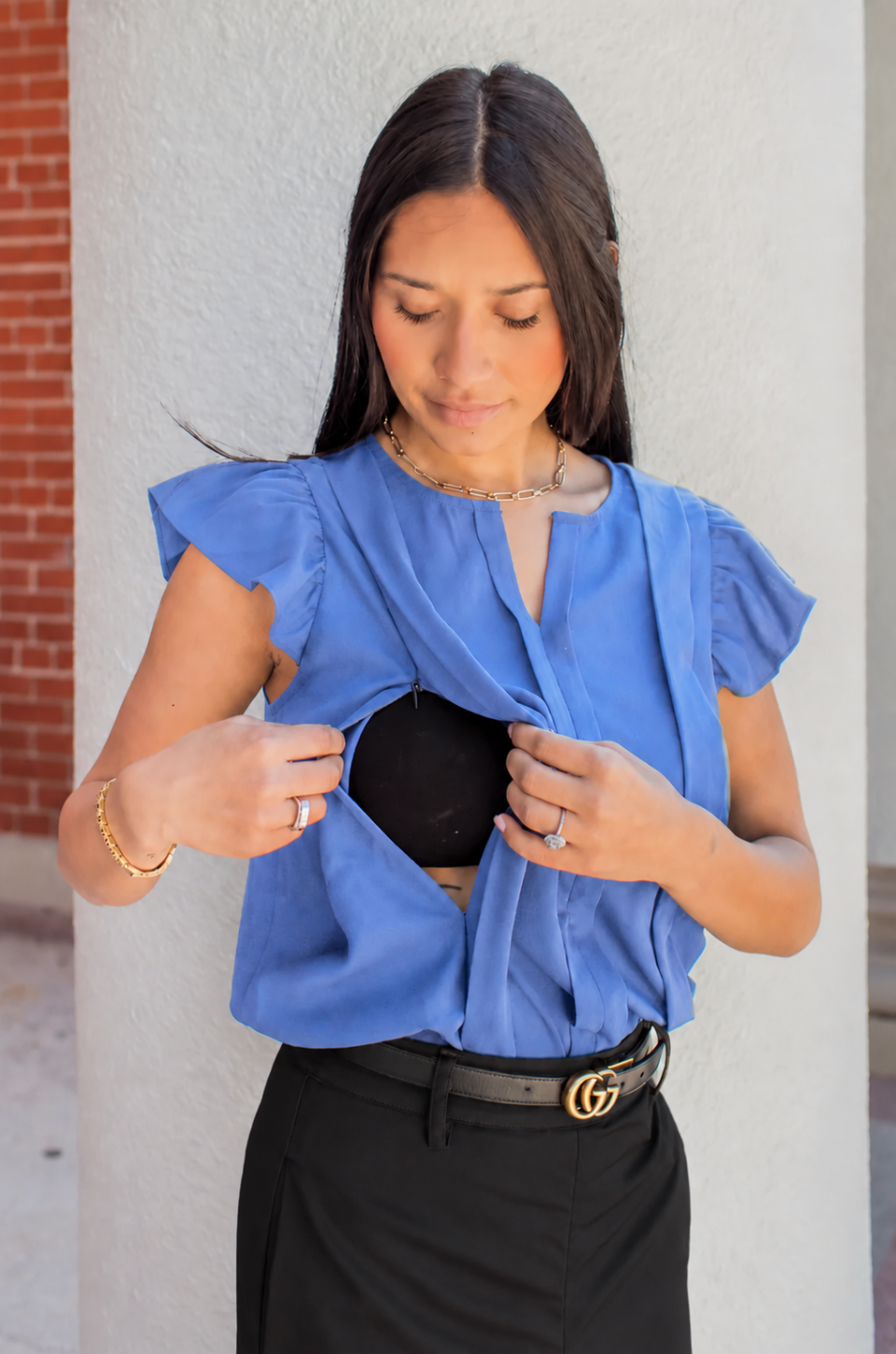Mom wearing a dressy blouse with hidden breastfeeding access for pumping or nursing at work or on the go. 