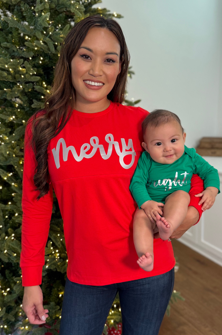 Mom wearing Merry shirt with matching baby onesie that says Bright