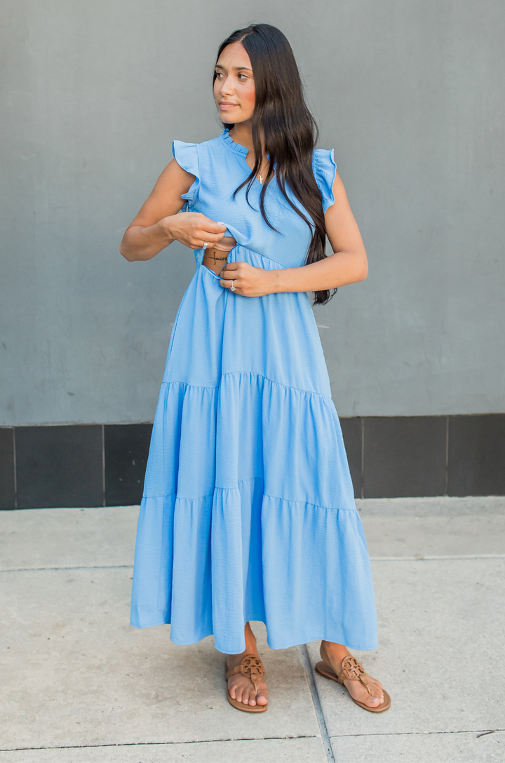 Mom showing how the hidden breastfeeding access opens on a summer dress designed for nursing and pumping on the go