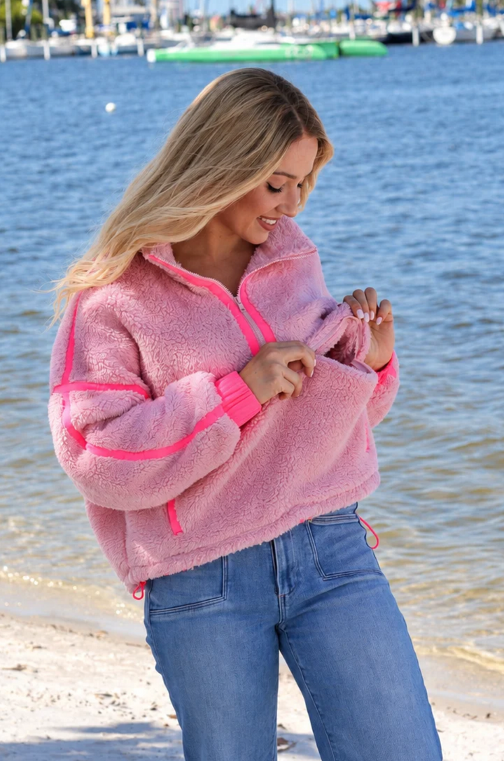 Mom showing the nursing access on a hot pink nursing fleece