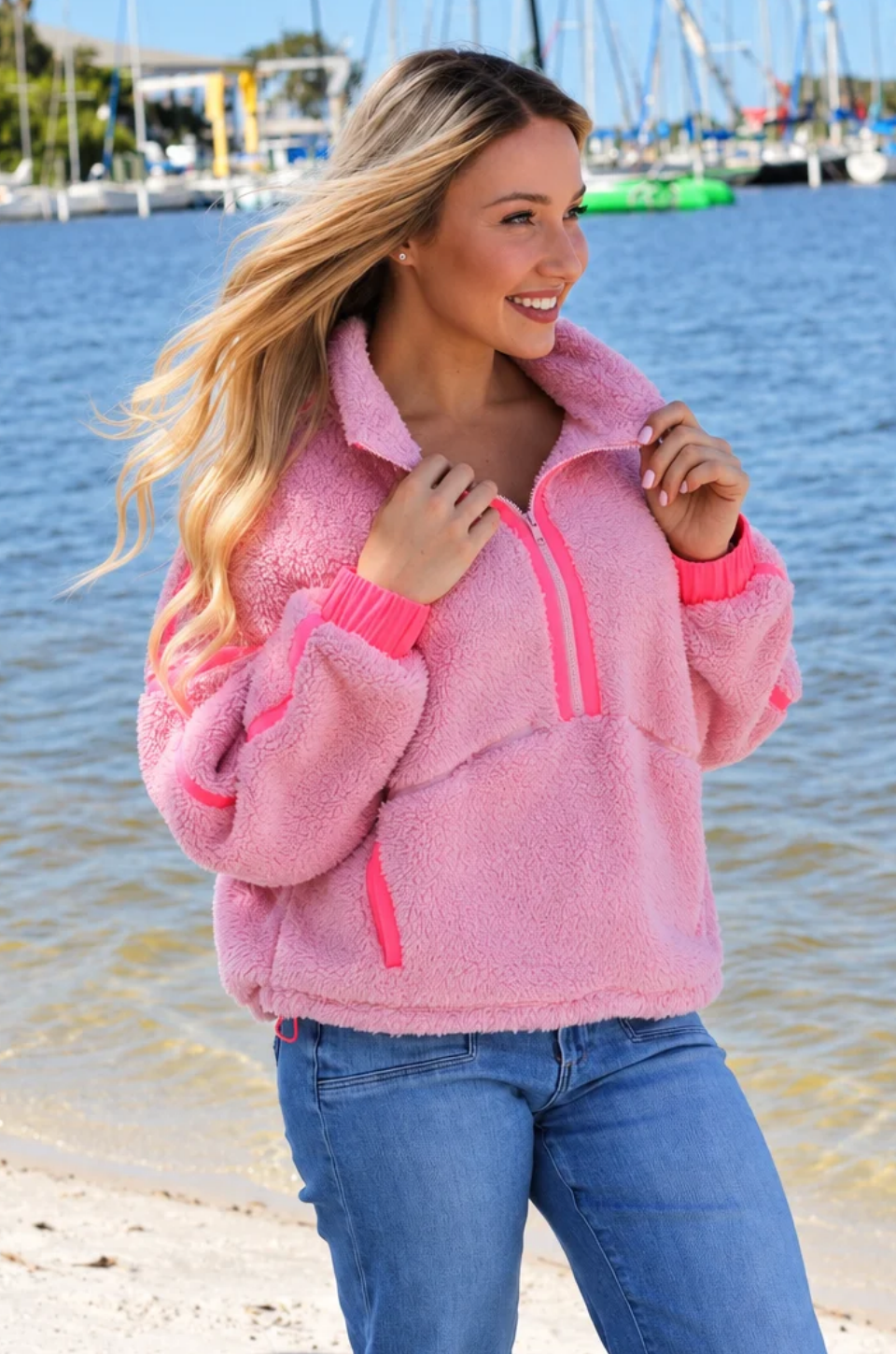 Mom wearing hot pink nursing fleece jacket