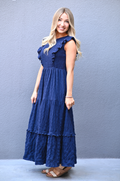 Side view of a mom wearing a Navy cotton nursing dress with pockets.
