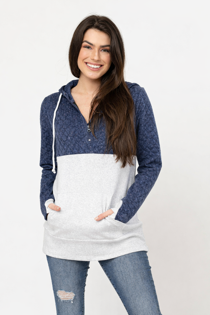 Front view of blue waffle knit breastfeeding hoodie with quarter-zip neckline and concealed zipper breastfeeding access