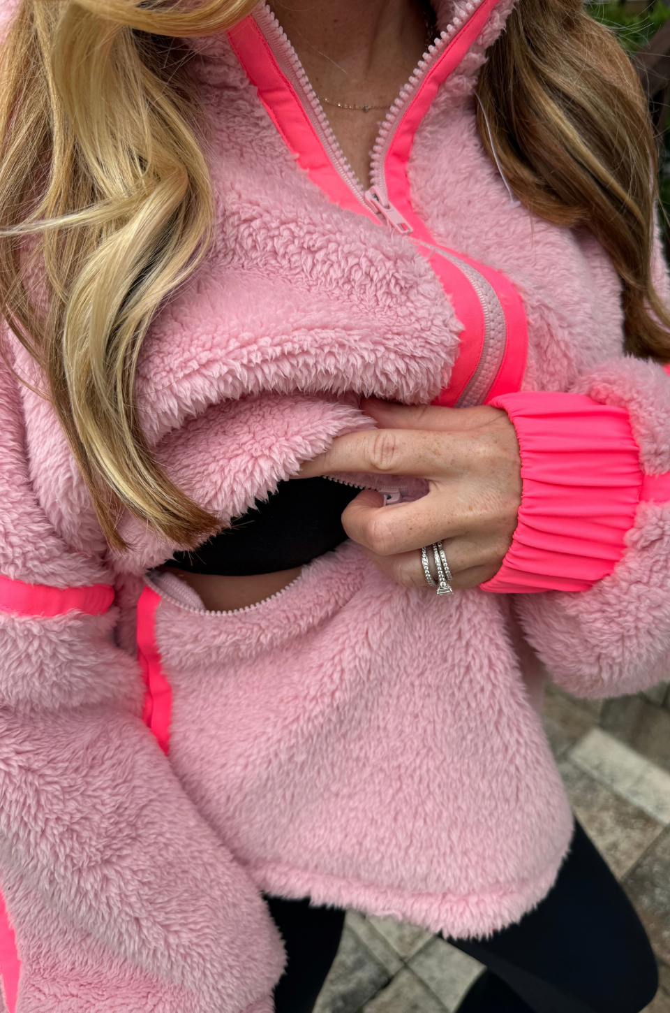 Close up of the breastfeeding access built into this nursing fleece jacket.