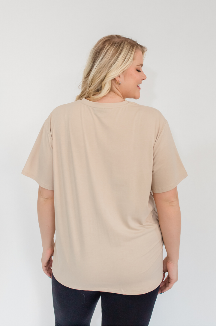 A back view shows a mom wearing the Los Angeles California breastfeeding graphic tan t-shirt with relaxed comfort and full coverage.