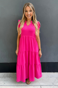 Breastfeeding mom wearing pink tiered nursing midi dress with ruffle sleeves and hidden zipper access for easy nursing and pumping