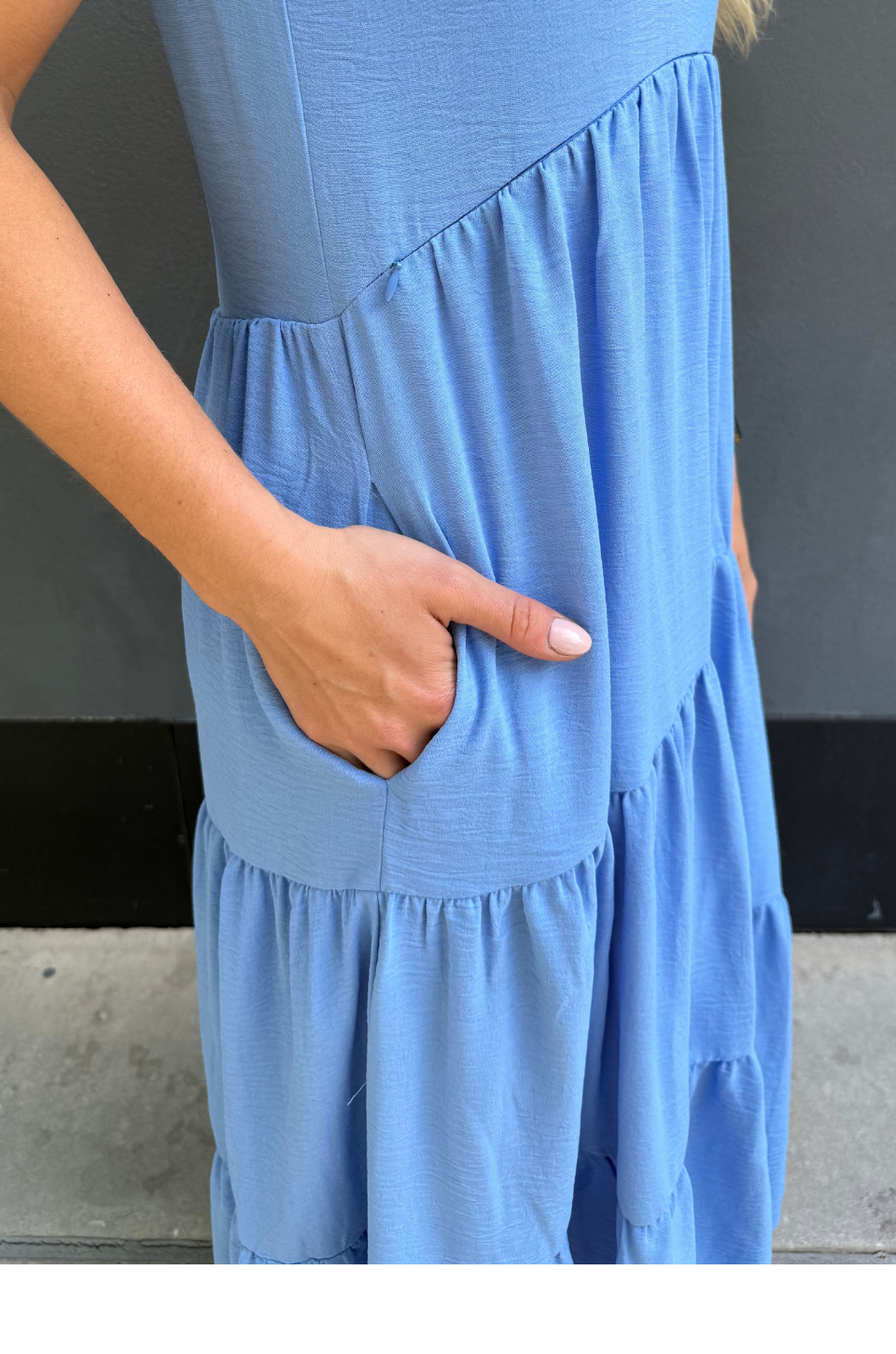 Close up of pockets on blue nursing dress for spring and summer 