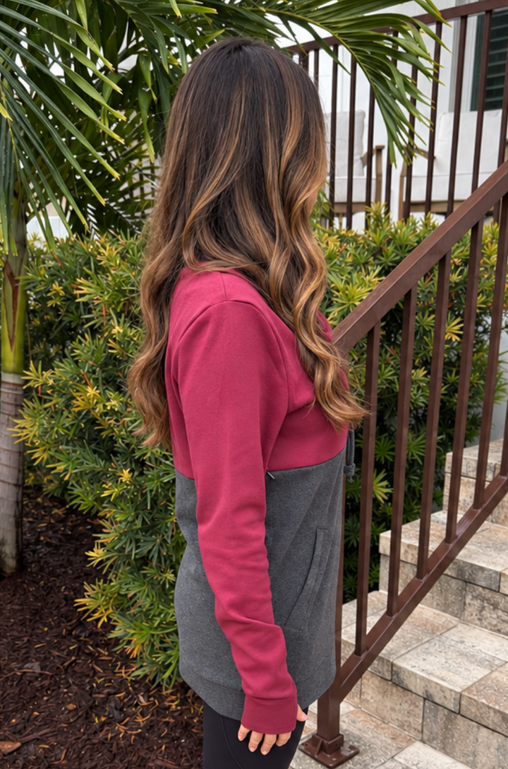 Side view of breastfeeding mom wearing a nursing and pumping hoodie 