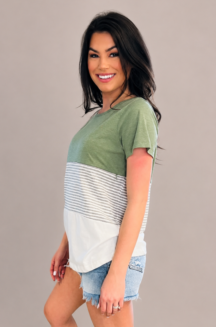 A side view shows a mom wearing the green 3-block colorblock breastfeeding t-shirt, emphasizing its soft drape and comfortable fit.