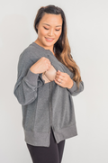 woman wearing dark gray oversized nursing sweatshirt