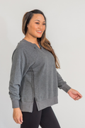 mom wearing dark gray nursing sweatshirt