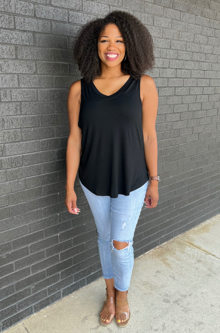 Front view of black breastfeeding swing tank top with flowy silhouette and side opening pumping and nursing access