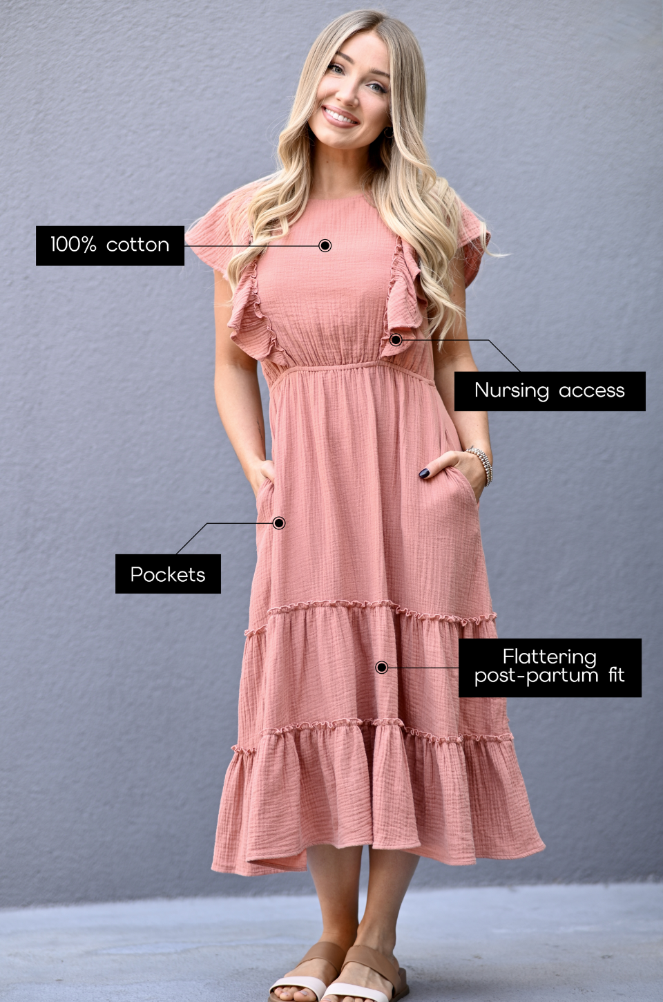 Woman wearing a terracotta gauze midi nursing dress made from 100% cotton with hidden zipper nursing access, pockets, and flattering postpartum fit.