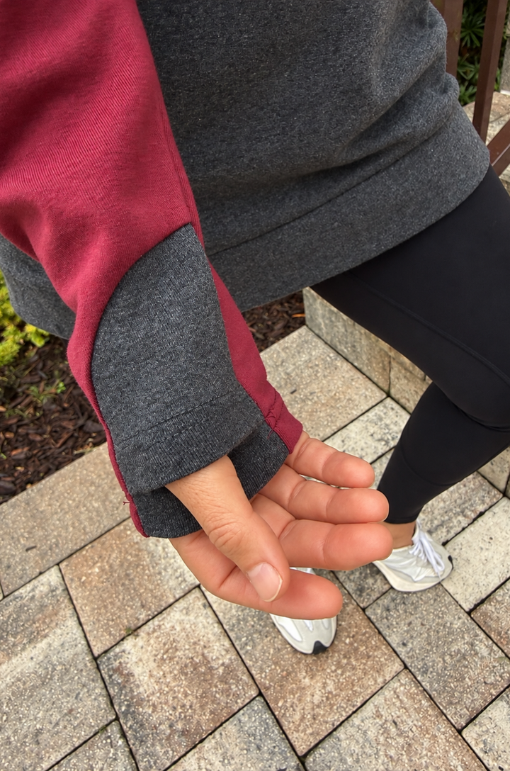 Close up of thumbholes on nursing hoodie for breastfeeding on the go