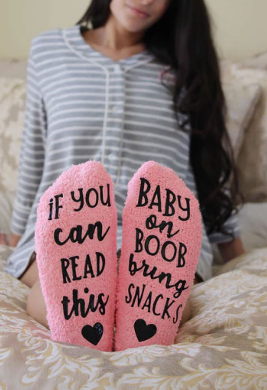 model wearing baby on boob fuzzy socks