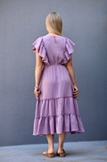 Back view of lavender gauze ruffle nursing dress with feminine fit and comfortable design for breastfeeding moms.